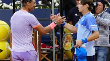 Rafael Nadal smiles while congratulating his conqueror Alex de Minaur at the Barcelona Open. (EPA PHOTO)
