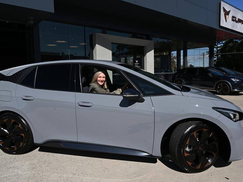 Sue Hogan drives her new Cupra Born electric vehicle in Sydney. (Dean Lewins/AAP PHOTOS)