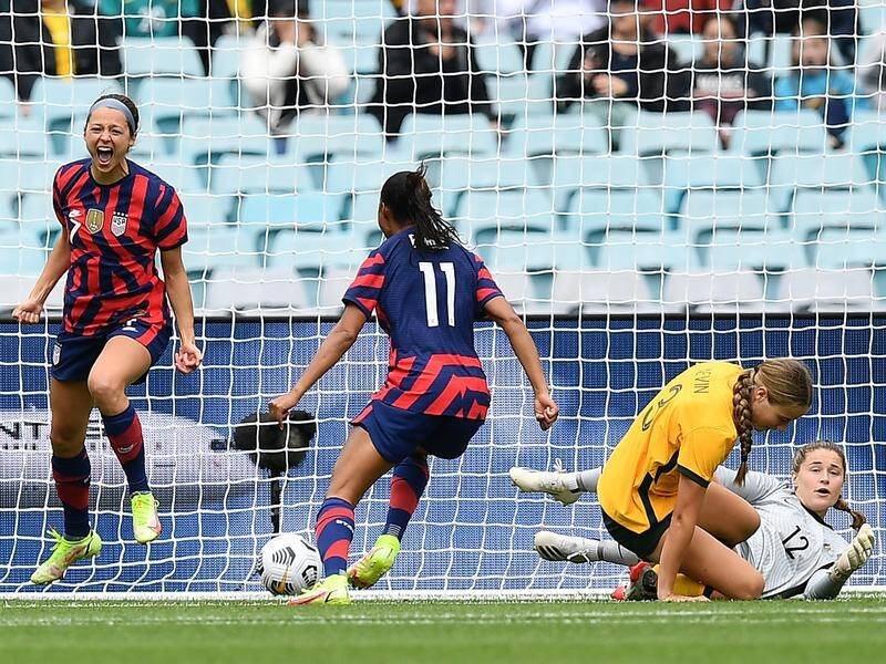 USA's Ashley Hatch (l) celebrates scoring after 24 seconds in the win over the Matildas in Sydney.