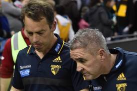Claims of racism under Alastair Clarkson (L) and Chris Fagan (R) at Hawthorn may be headed to court. (Julian Smith/AAP PHOTOS)