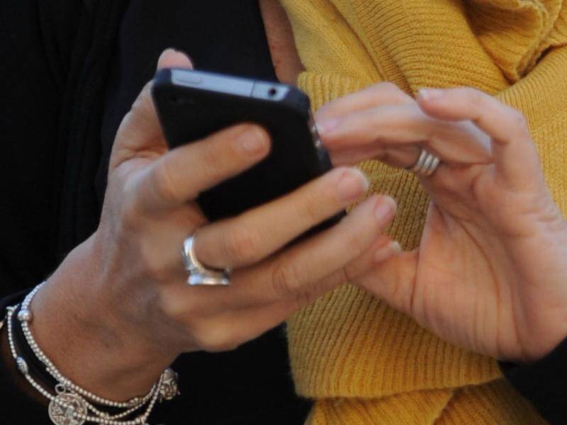 The communications watchdog has issued an order to telcos that failed to follow rules on SMS scams. (Julian Smith/AAP PHOTOS)
