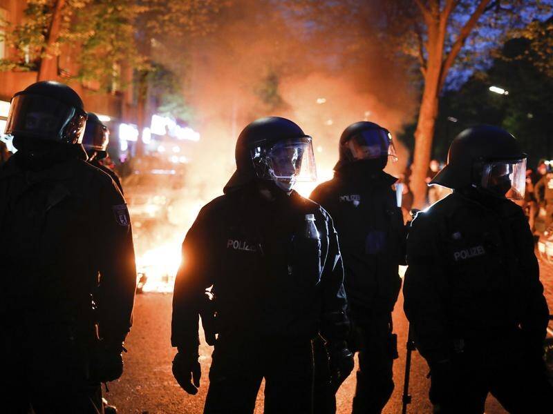 May Day rallies have turned violent in Berlin where police were pelted with rocks and bottles.