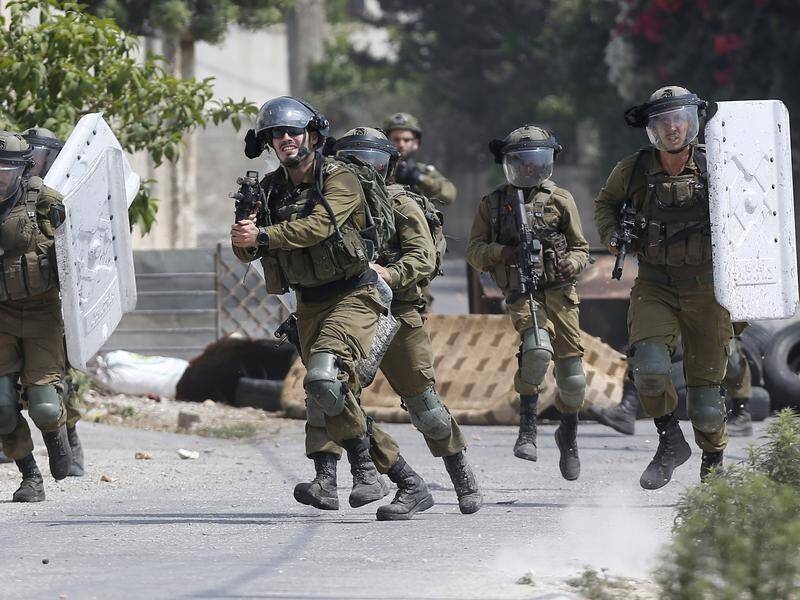 Israeli soldiers and Palestinian protesters continue to clash in the occupied West Bank. (EPA PHOTO)