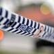 Brisbane police are waiting to speak to a man after a suspicious device sparked two sieges.