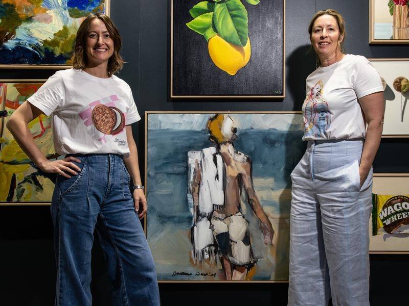 Toowoomba Gallery co-owners Niki Hall and Bec Statton at the Affordable Art Fair in Melbourne. (Diego Fedele/AAP PHOTOS)