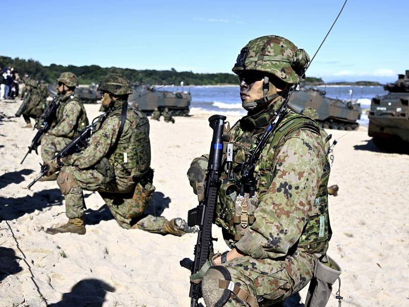 Japan has revealed a revamped national security stategy that includes a $A477b military build-up. (AP PHOTO)