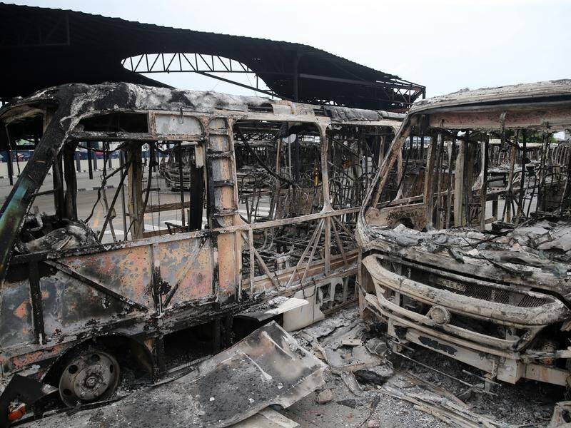 Burnt vehicles at a bus terminal in Lagos after two weeks of angry protests over police brutality.