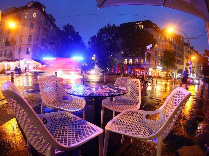 An empty sidewalk table in Berlin after curfew time for bars and restaurants.