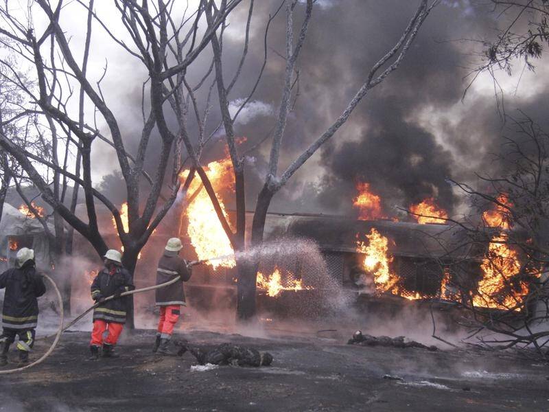 A damaged petrol tanker in Tanzania has exploded as people were trying to siphon fuel from it.