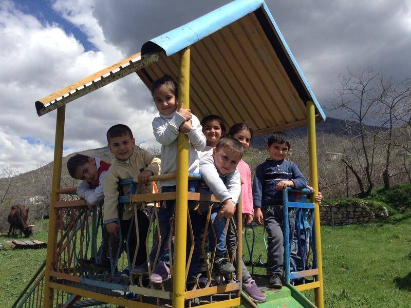 Despite the ever-present threat of violence, young children in Armenia continue to learn and play.