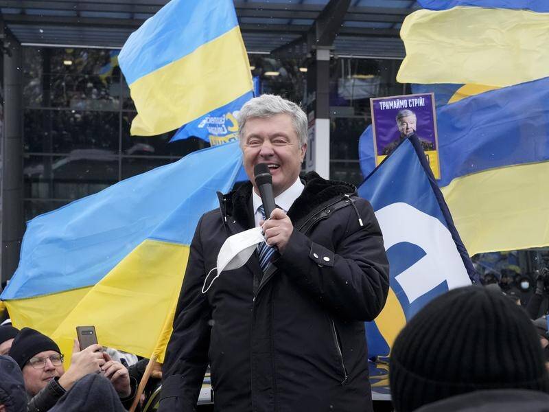 Petro Poroshenko says being blocked by authorities from leaving Ukraine is an "attack on unity". (AP PHOTO)