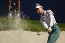 Nelly Korda chips from a bunker during her troubled first round at the US Women's Open. (AP PHOTO)