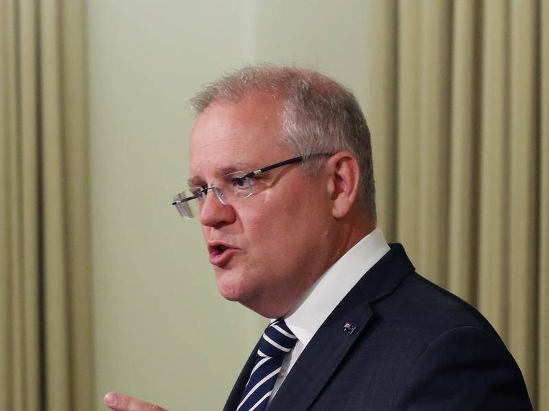 Prime Minister Scott Morrison has cut his family holiday short after two NSW bushfire fighters died.