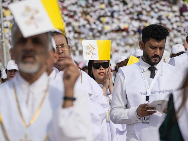 Hundreds of Catholic foreign workers travelled in from around the Gulf to attend the Pope's mass. (AP PHOTO)