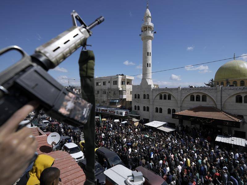 A funeral procession in Nablus became chaotic as mourners chanted against the Palestinian Authority. (AP PHOTO)