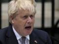 Prime Minister Boris Johnson reads a resignation statement outside 10 Downing Street, London.