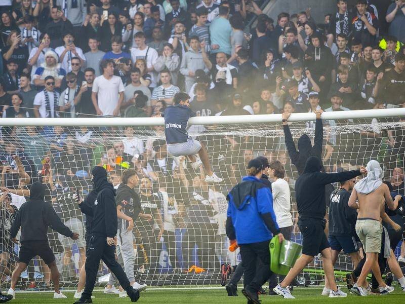 More life bans are in the offing following Saturday's pitch invasion by Melbourne Victory ALM fans. (Will Murray/AAP PHOTOS)