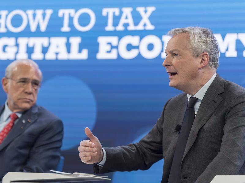 French Finance Minister Bruno Le Maire (R) says the US agreed on progressing talks on a digital tax.