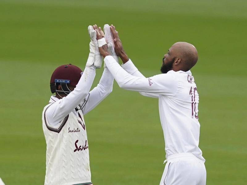 Roston Chase (R) has taken two wickets as the West Indies reduced England to 3-113 at tea.