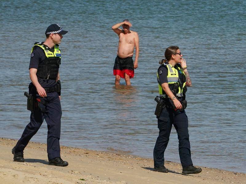 Police patrols will continue at Melbourne's St Kilda Beach after large groups flouted restrictions.