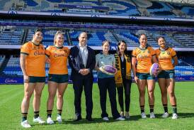 Wallaroos players join Rugby Australia CEO Phil Waugh and head coach Jo Yapp at the Cadbury launch. (Bianca De Marchi/AAP PHOTOS)