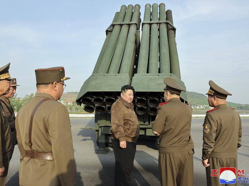Kim Jong-un has supervised a test firing of a new multiple rocket launch system in North Korea. (AP PHOTO)