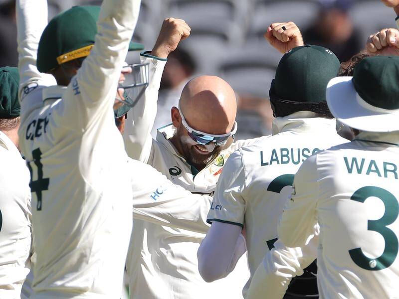 Nathan Lyon has celebrated his 500th Test wicket during Australia's 360-run win against Pakistan. (Richard Wainwright/AAP PHOTOS)