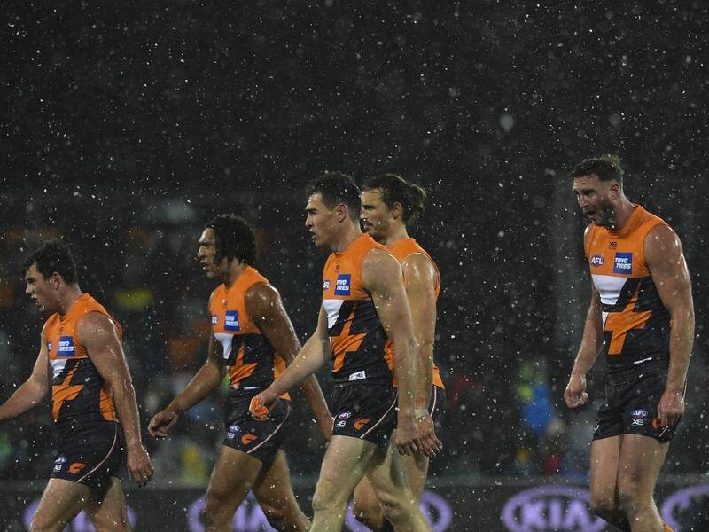 Snow fell before Hawthorn burnt the GWS Giants by 56-points in a frigid Canberra.