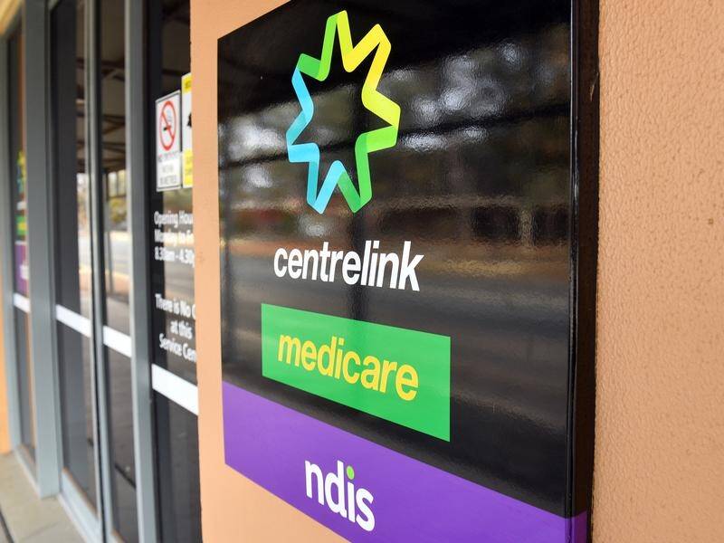 The federal government says a cashless welfare card trial in two Queensland town has been a success.