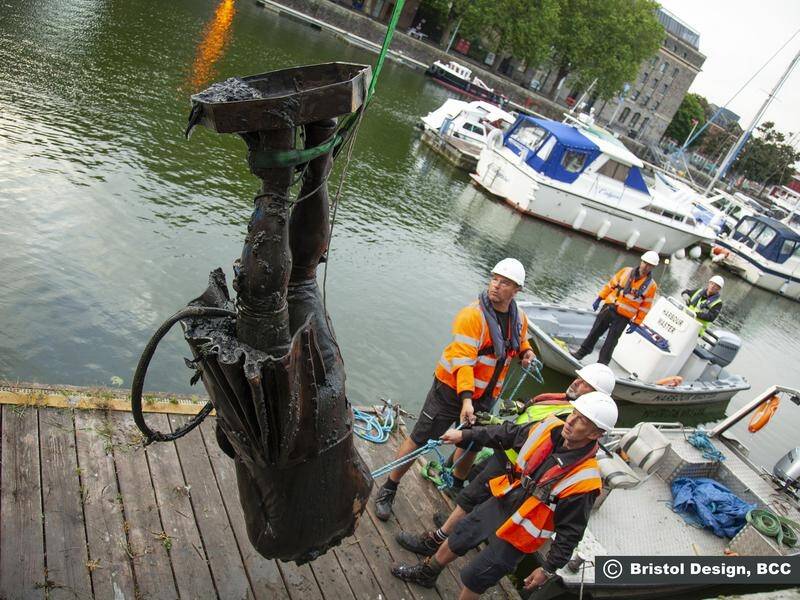 The toppled statue of slave trader Edward Colston is fished from the harbour at Bristol.