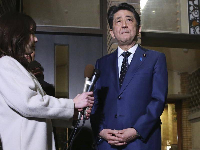 Japanese Prime Minister Shinzo Abe says the IOC president has agreed to postponing the Olympics