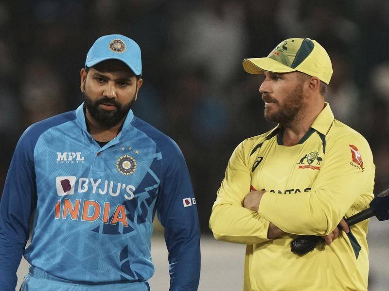 India's captain Rohit Sharma, left, and Australia's Aaron Finch wait for the toss in Hyderabad. (AP PHOTO)