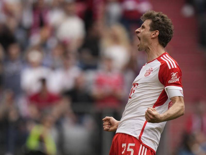 Bayern's ageless Thomas Muller celebrates his clincher in their Bundesliga win against Cologne. (AP PHOTO)