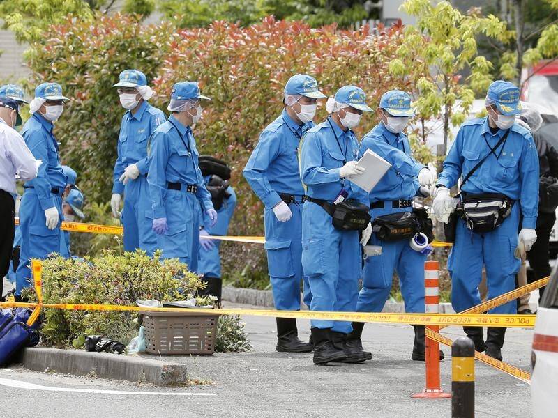 Police investigate the scene of a mass stabbing in Kawasaki, near Tokyo, Japan.