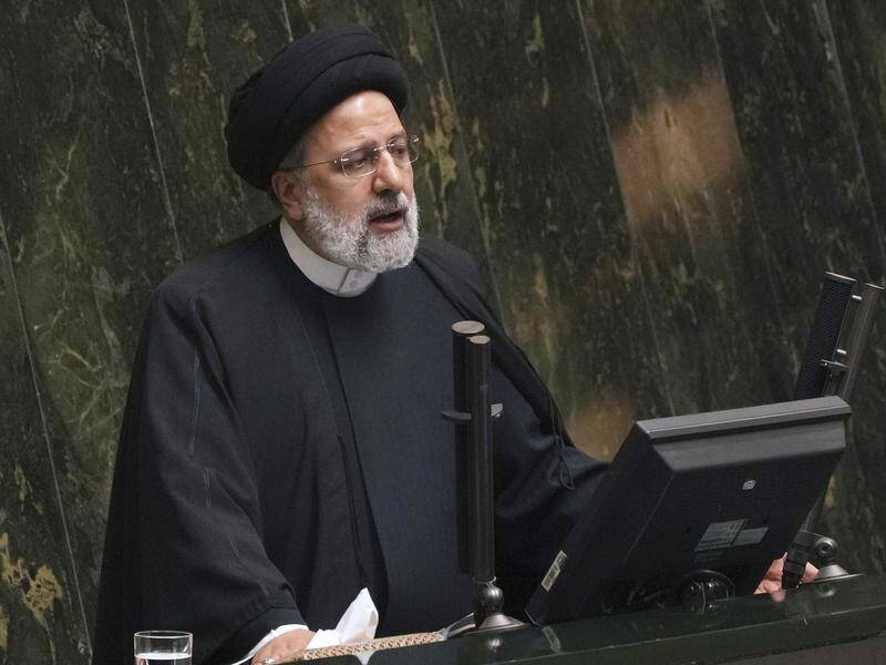 Iranian President Ebrahim Raisi says foreign forces are trying to "instil fear and insecurity". (AP PHOTO)