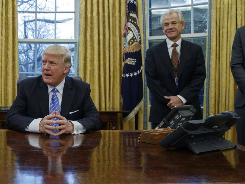 Former Trump adviser Peter Navarro, right, has been subpoenaed over his role in the US Capitol riot.