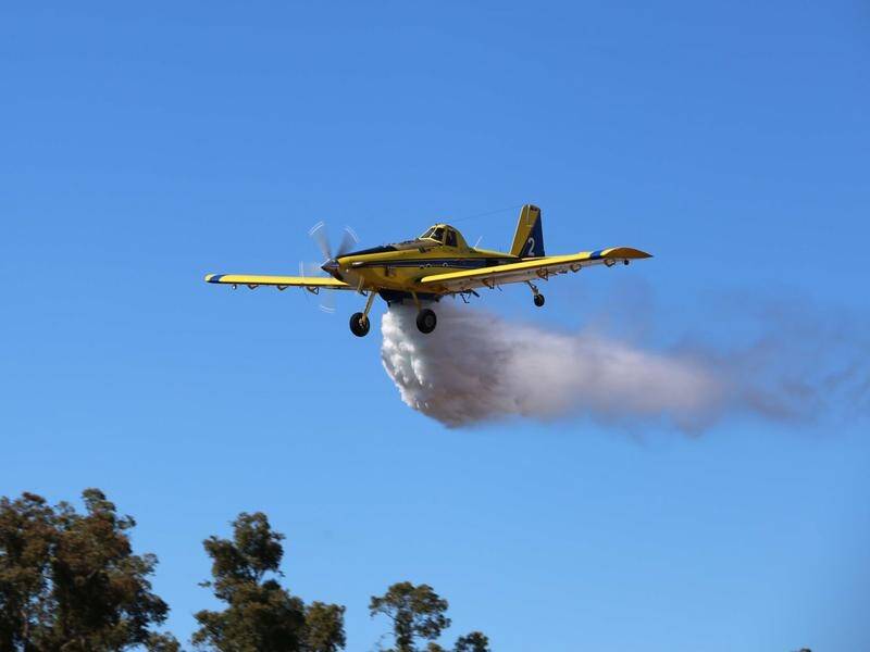 Water bombing planes were deployed over a fire that threatened homes in southern WA.