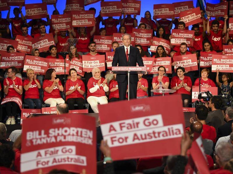 Labor party volunteers listen to Opposition Leader Bill Shorten at a rally in Sydney.