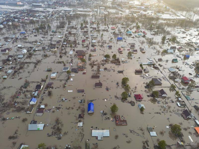 Floodwaters have forced more than 110,000 people from their homes in Russia, Siberia and Kazakhstan. (EPA PHOTO)