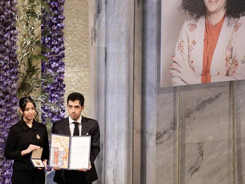 Imprisoned Narges Mohammadi's Nobel Peace Prize was collected by her children Ali and Kiana Rahmani. (EPA PHOTO)