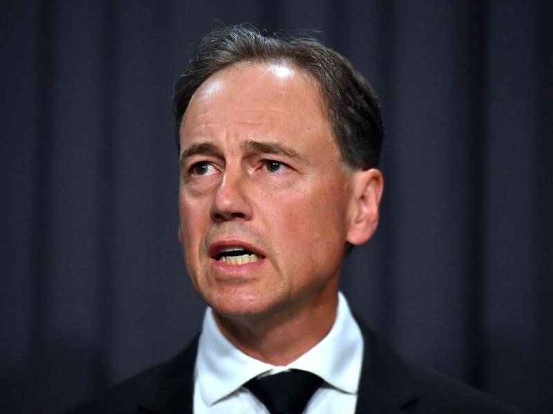 Greg Hunt has unveiled a free type one diabetes monitoring system but Labor says it's a year late.