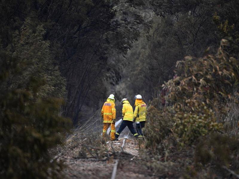 Cooler conditions over Christmas will aid firefighters still battling 75 grass and bushfires in NSW.