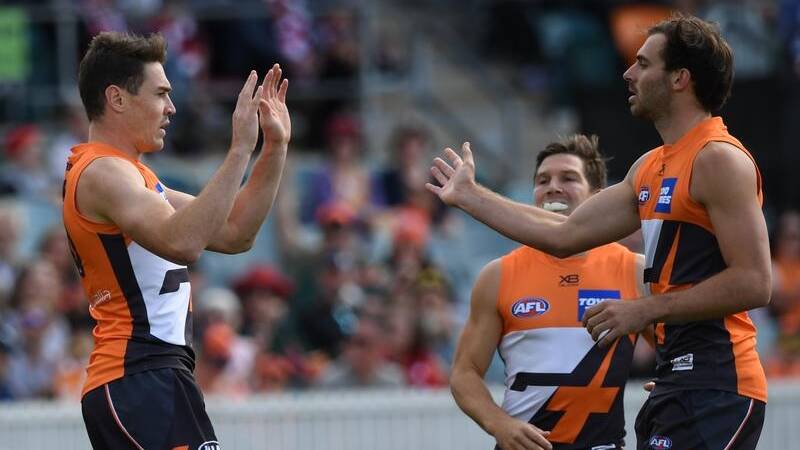 Jeremy Cameron (L) has kicked six goals for GWS who've thrashed St Kilda by 44 points in Canberra.