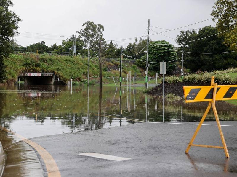 Parts of Queensland are back on flood watch with dams overflowing or releasing water after rainfall.