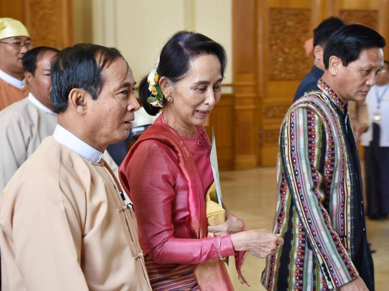 Win Myint (left) has testified alongside Aung San Suu Kyi (centre) at a trial on incitement charges