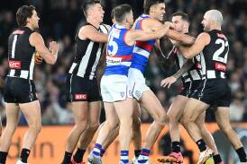 Collingwood players were not impressed with Western Bulldogs big man Sam Darcy (centre) on Friday. (Joel Carrett/AAP PHOTOS)
