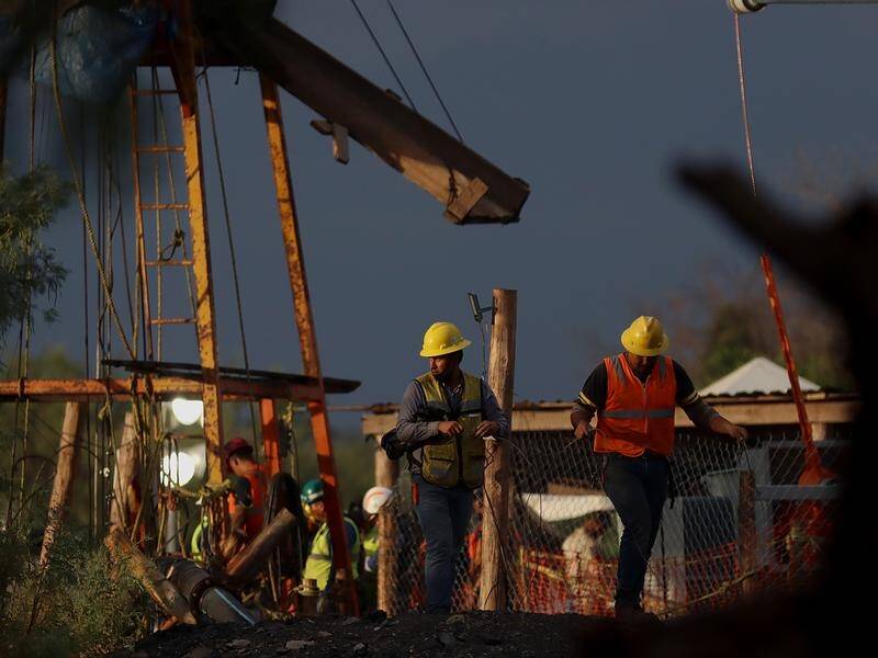 The rescue effort to free ten people trapped in a flooded mine in northern Mexico continues. (EPA PHOTO)