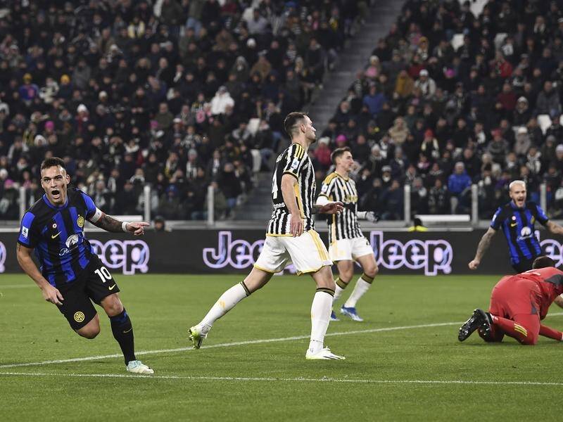 Lautaro Martinez (l) celebrates his equaliser for Inter Milan in their 1-1 draw with Juventus. (AP PHOTO)
