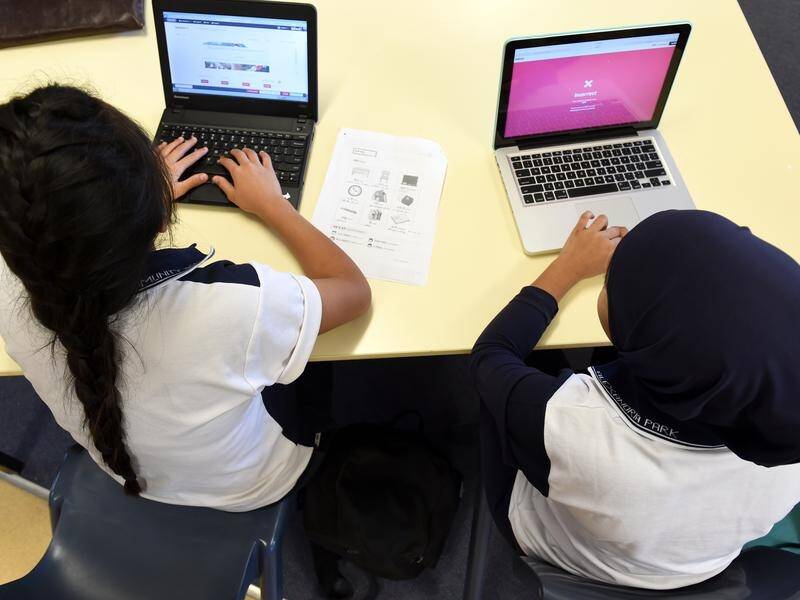 Victorian state school students have been banned from using ChatGPT while on school grounds. (Paul Miller/AAP PHOTOS)
