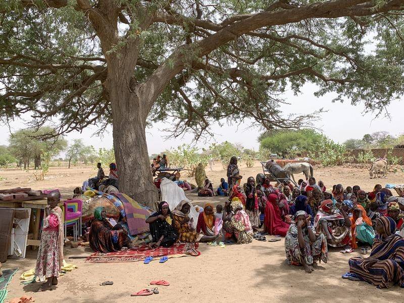 Tens of thousands have fled the violence in Sudan, many walking hundreds of kilometres. (AP PHOTO)